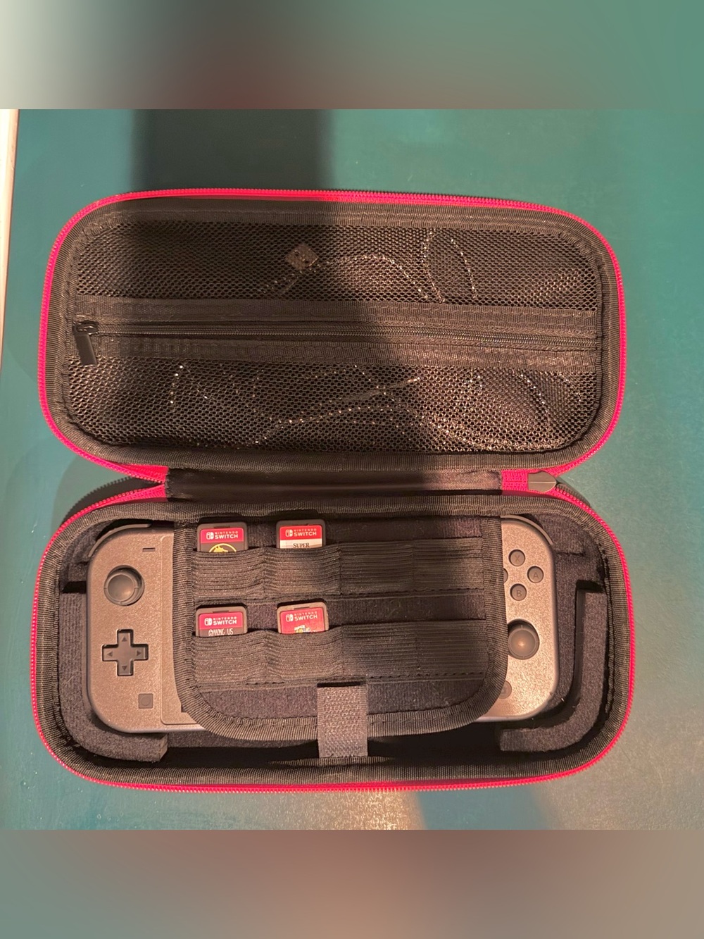 Nintendo Switch with four games, charger, case